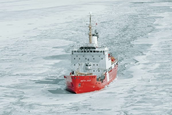 Canadian Coast Guard icebreaker Martha L. Black cutting a channel through broken sea ice.