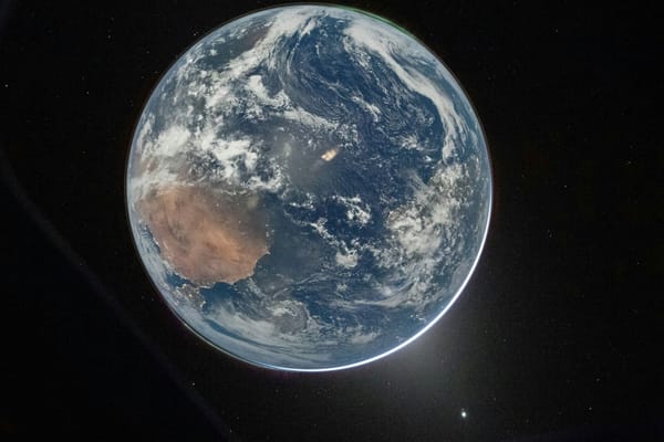 View of Earth from space, with the Indian Ocean, Australia, cloud systems, and the planet’s curved horizon visible.