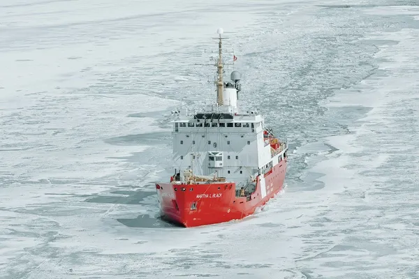 Canadian Coast Guard icebreaker Martha L. Black cutting a channel through broken sea ice.
